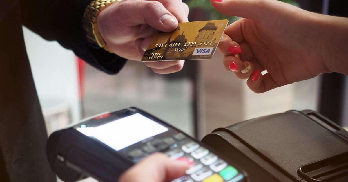 Close-up of a credit card payment being processed at a POS terminal.